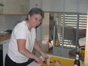 Chus slicing up some bread for lunch.