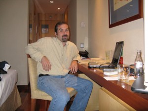 Our first day in Madrid! Puck is checking e-mail in our hotel room.