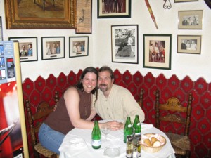 There are bullfighting photos, paintings and memorabilia on the walls behind us.