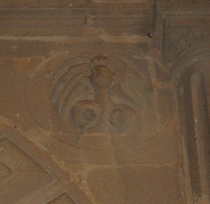 The architecture in Cáceres at times reflects the influence of the "New World" in Spain. Here a Native American graces the architecture of a building.