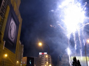 The fireworks marked the beginning of the night on the town and did homage to the large image of the moon hanging from the building to the left.