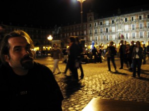 You can see the Plaza Mayor behind Puck. It is a gathering area in Spain where many activities have taken place over the years.