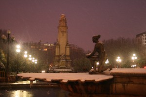 There is a lovely fountain with two statues of women on it in the plaza.