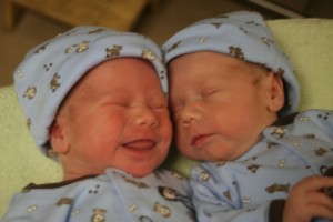 Alexander smiles in his sleep as he snuggles with Dominic.