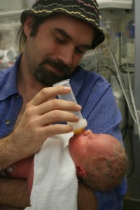 img_6482_puck_alex Dad bottlefeeds Alex for the first time.