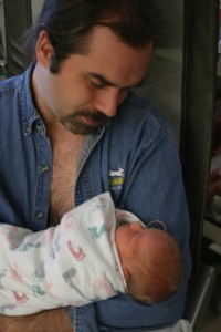 img_6607_puck_alex Dad snuggling with Alexander.