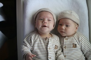 Dom lifts his chin to laugh at Daddy.