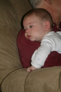 Dom snuggles with Papa.