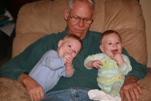 Alex gives Papa a snuggle and Dom laughs at his daddy.