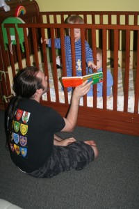 The Twin-Daddy reads Dom (left) and Alex a bedtime story.