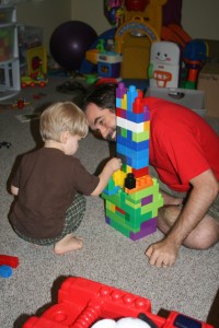 Alex and Puck build another tower.
