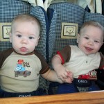 Dom (left) and Alex enjoy brunch in their upright stroller.